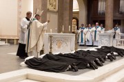 The sisters’ scapulars are blessed as they make a prostration.