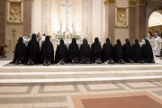 The sisters receive a blessing from the Bishop.