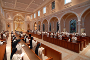 Choir stall section of chapel with Sisters at prayer