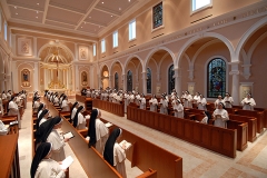 Choir stall section of chapel with Sisters at prayer