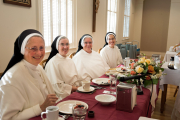 Sister Mary Christopher enjoys a festive breakfast with Sister Catherine Marie, Mother Anna Grace, and Sister Anne Catherine in celebration of her 50th anniversary of vows.