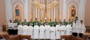 The sisters pose with Bishop Michael Izen, Archdiocese of Minneapolis St. Paul, the priest concelebrants, and the altar servers