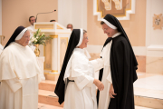 During the sign of peace, all perpetually professed sisters give Sister Aimee Marie the sign of peace.