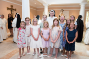 Sister Aimee Marie is joined by many of the students she taught at St. Henry School.