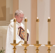 Father James Brent, O.P. prepares to read the Gospel.