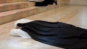Sister Aimee Marie prostrates towards the altar while the Congregation chants the Litany of the Saints.
