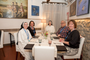 Mother Anna Grace and Sister Anne Frances enjoy dinner with fellow pilgrims.
