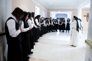Mother Anna Grace, Sister Mary Rachel, and Sister Marie Hannah pray with the postulants before they receive the Dominican pin during their pinning ceremony, marking the beginning of their postulancy.