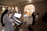 The orchestra played entrance music as the sisters processed into the refectory.