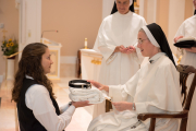 Mother gives each piece of the habit to the postulant with a brief statement of the significance of that clothing.
