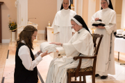 Mother gives each piece of the habit to the postulant with a brief statement of the significance of that clothing.