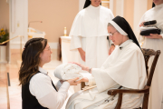 Mother gives each piece of the habit to the postulant with a brief statement of the significance of that clothing.