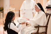 Mother also gives the postulant her new religious name.