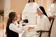 Mother also gives the postulant her new religious name.