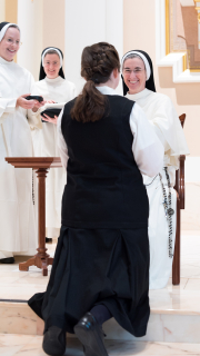 At the end of the postulancy, she receives the habit from prioress general and begins the canonical year.