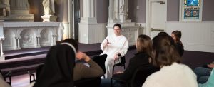 Dominican friar talking with retreatants