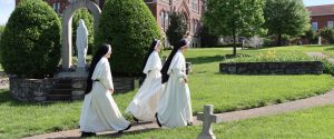 sisters walking in cemetery