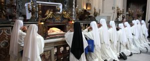 sisters praying at tomb of St. Cecilia
