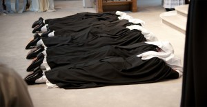 Sisters prostrate during Profession Mass